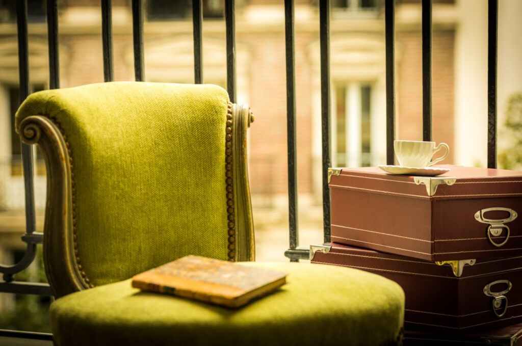 yellow book on green ottoman